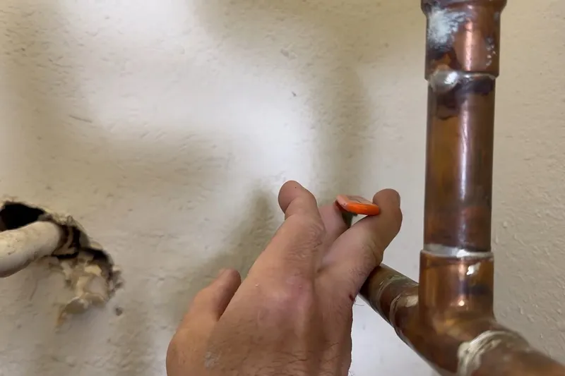 Corroded water heater anode rod removed for inspection for Replacing the anode rod