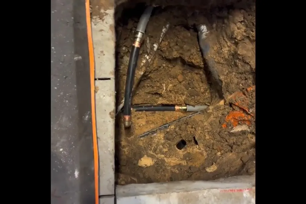 Exposed underground sewer pipe during repair for Roots inside a sewer pipe
