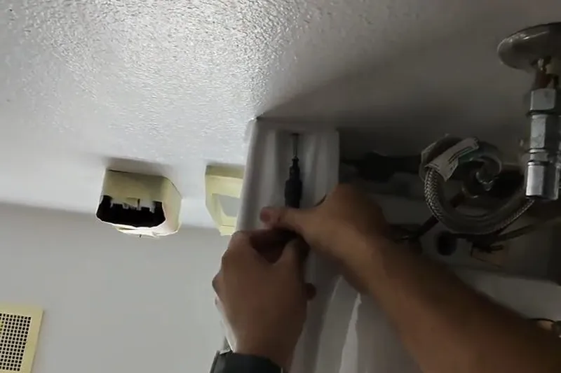 Sink faucet and under-sink drain connection being serviced for A worn faucet cartridge in Prescott Valley, AZ